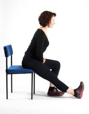 Woman demonstrating back of thigh stretch leaning forward