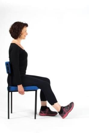 Woman demonstrating thigh strengthener