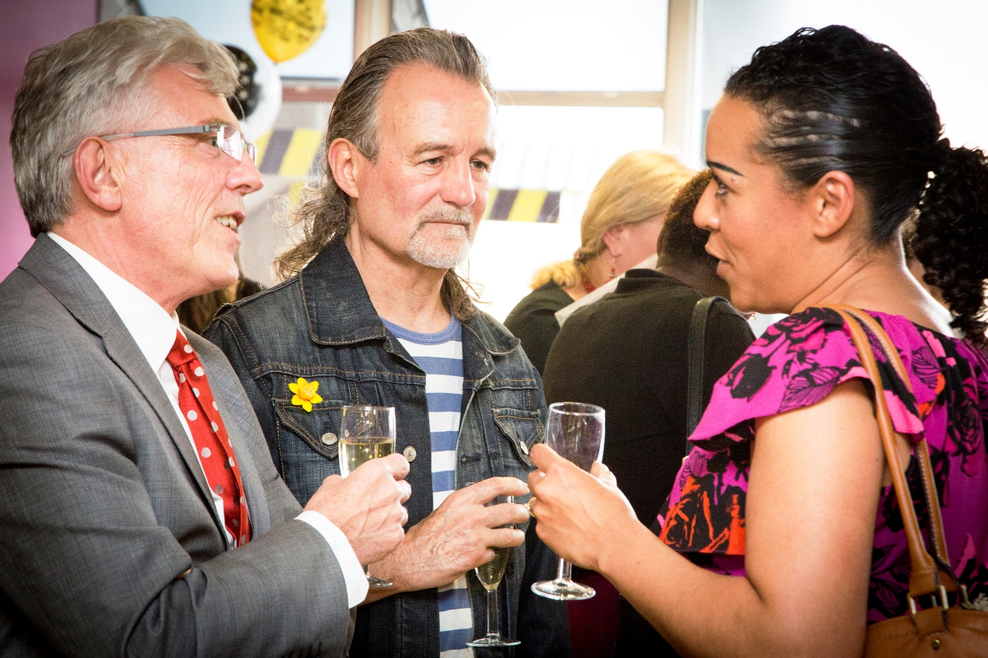 David Sloman, CEO, talks to volunteers at the party