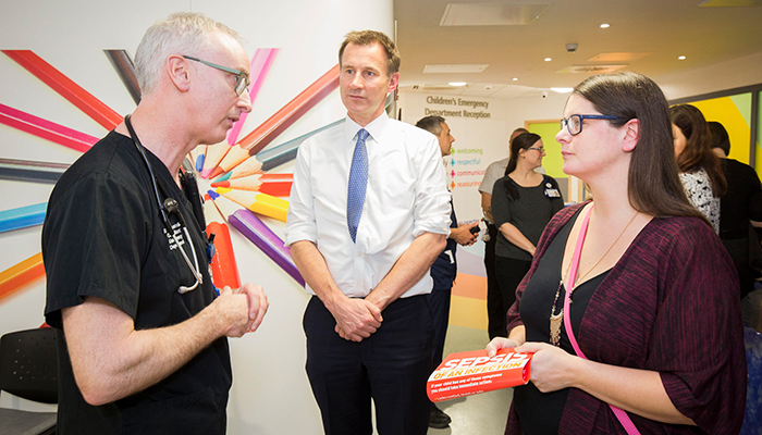 Jonathan Costello, clinical director for the emergency department, talks to Secretary of State for Health Jeremy Hunt and Melissa Mead