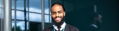 Man smiling outside of hospital