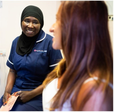 Mother talking with community midwife