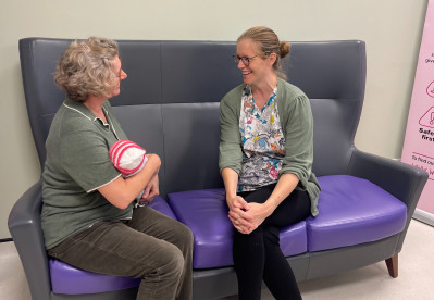 Mother talking with community midwife