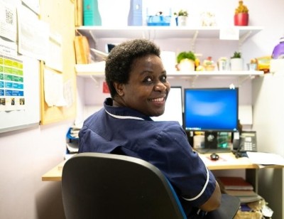 Matron smiling over her shoulder